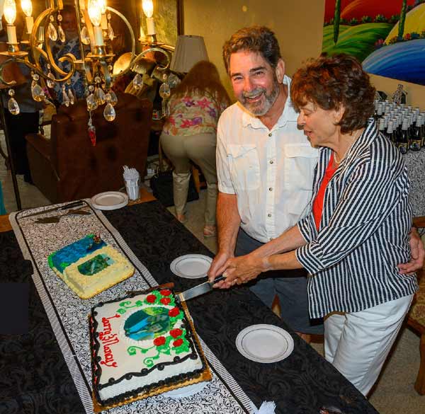 Larry and Nancy cut the cake